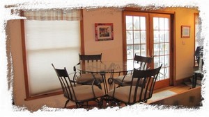 Third Floor breakfast nook and double doors leading to deck.