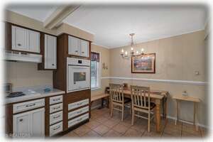 Dining Area {Seats 6 ~ Extra Chairs & Bench Cushions Provided}