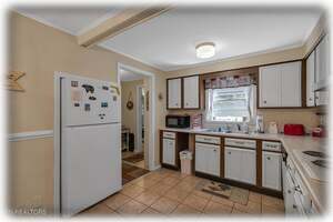 Fully-Equipped Kitchen Leading To Pantry & Third Bedroom